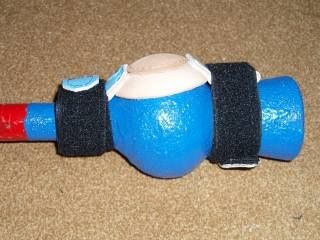 Clapper with velcro muffle fully attached